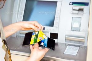 Woman has cash withdrawal with Visa card  into the ATM